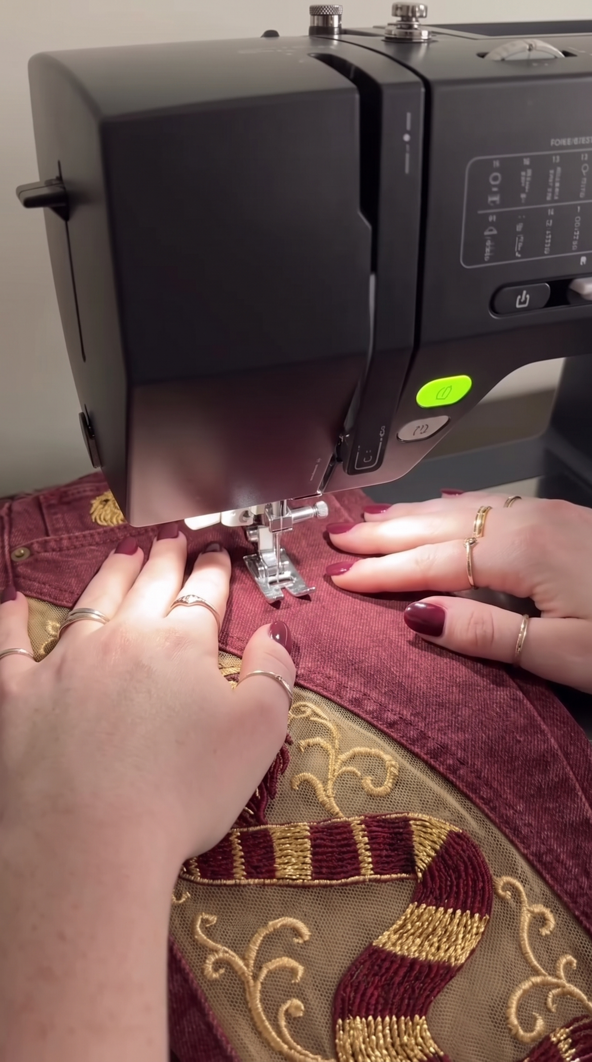 Gold embroidery being stitched onto a side panel